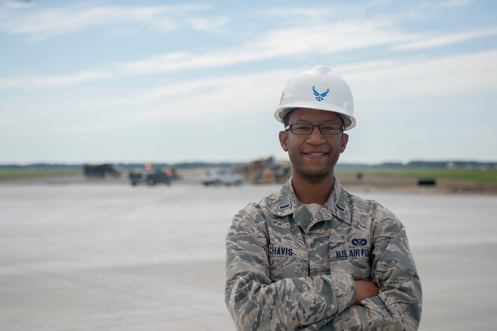 1st Lt. Prince Chavis, civil engineer officer with the 822nd Civil Engineer Flight, stands in front of Dover Air Force bases’ under construction runway Aug. 8, 2016, Dover Air Force Base, Del. Lt. Chavis is a member of a civil engineering team which provides engineering management Air Force wide. 
