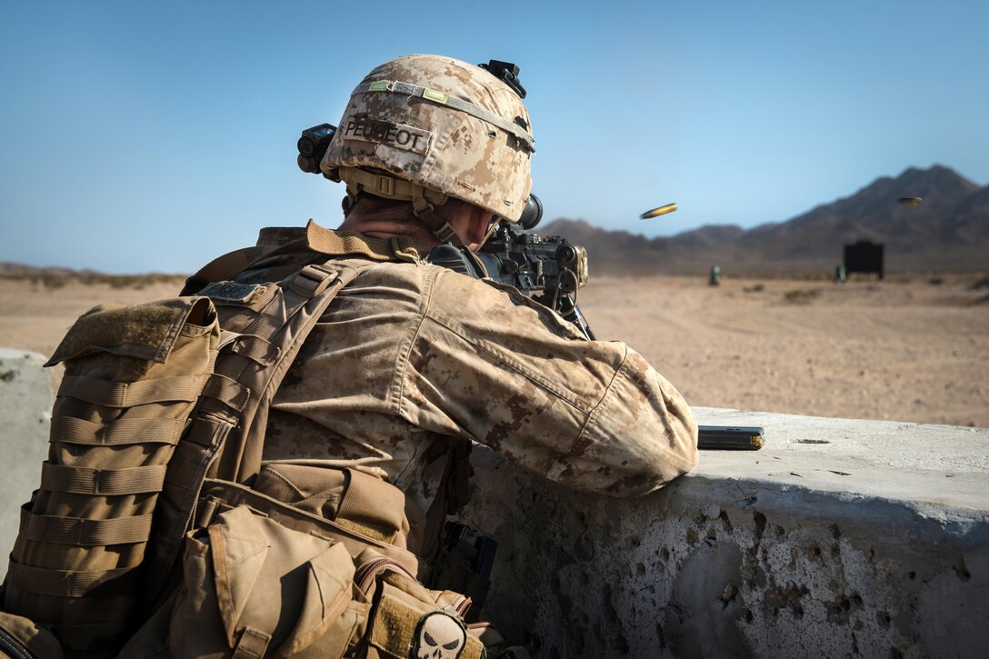 A Marine provides cover fire for his squad during Marine Air Ground Task Force Integrated Experiment 2016 at Marine Corps Air Ground Combat Center Twentynine Palms, Calif., Aug. 5, 2016. The Marines were assigned to Kilo Company, 3rd Battalion, 5th Marine Regiment. During the five-day experiment, the Marines tested new equipment and concepts to help the Marine Corps meet the challenges of future operating environments. Marine Corps photo by Lance Cpl. Julien Rodarte