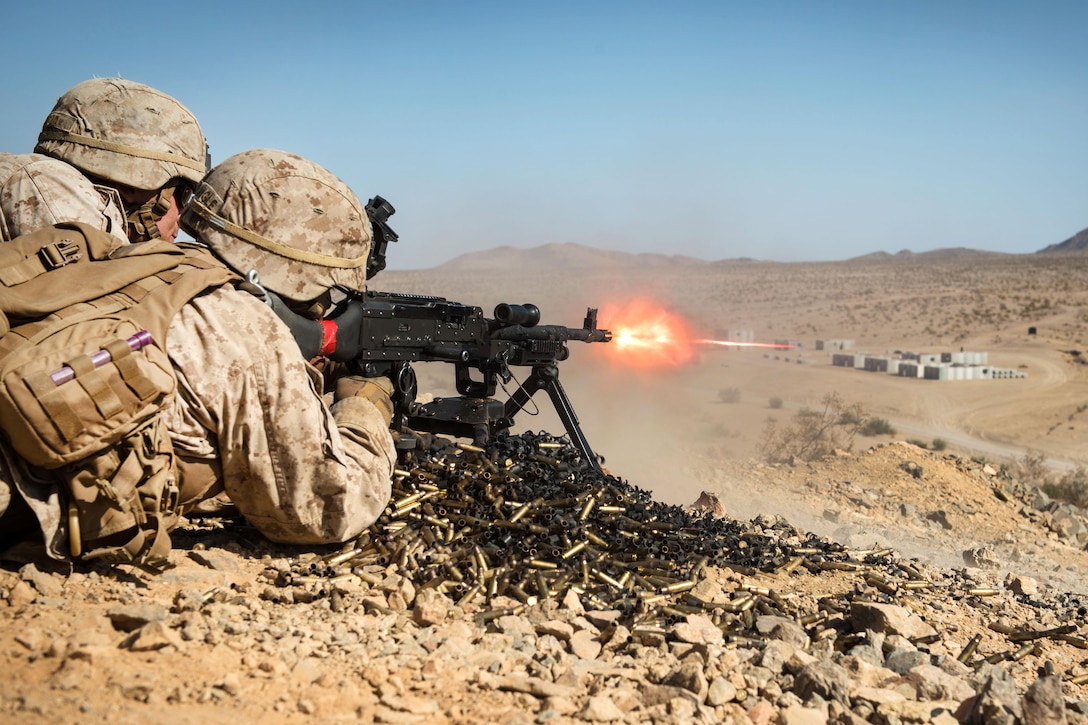 A Marine fires an M240G machine gun to provide cover for his squad during Marine Air Ground Task Force Integrated Experiment 2016 at Marine Corps Air Ground Combat Center Twentynine Palms, Calif., Aug. 5, 2016. Marine Corps photo by Lance Cpl. Julien Rodarte