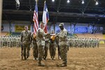 The 176th Engineer Brigade Commander, Colonel  Charles M. Schoening and Command Sergeant Major  Anthony Simms furl the brigade colors in preparation for deployment during the mobilization ceremony held for the brigade headquarters at Cowtown Coliseum in Fort Worth, Texas, June 4, 2016.  The 176th Engineer Brigade headquarters boarded a flight in late July and set off on an historic mission to the Middle East to provide engineer support and capabilities to maneuver units across the U.S. Central Command area of responsibility. 