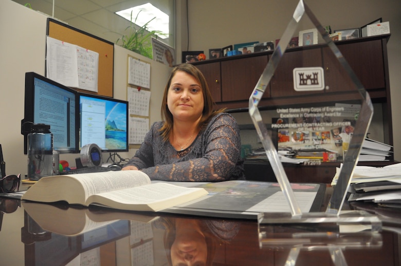 Jennifer Murphy-Mason, a Savannah District contracting officer, wins the U.S. Army Corps of Engineers 2015 Procurement Contracting Officer of the Year for major contributions to two features of the Savannah Harbor Expansion Project. Murphy-Mason is pictured Aug. 8 with her award, symbolizing the culmination of managing more than 1,249 contract actions valuing $674 million during the nominating period. Murphy-Mason accepted the award July 26 at the National Contract Management Association World Congress held in Orlando, Florida. Her 14-year Corps career began as a student in the district's Contracting Division in 2002. In 2010, she received a contracting officer warrant, which allows contracting staff to obligate the government for contracting actions. 2015 was a breakout year for Murphy-Mason, who won her first national awards for PCO of the Year and Project Development Team of the Year, the latter received for her contributions to a collective effort.