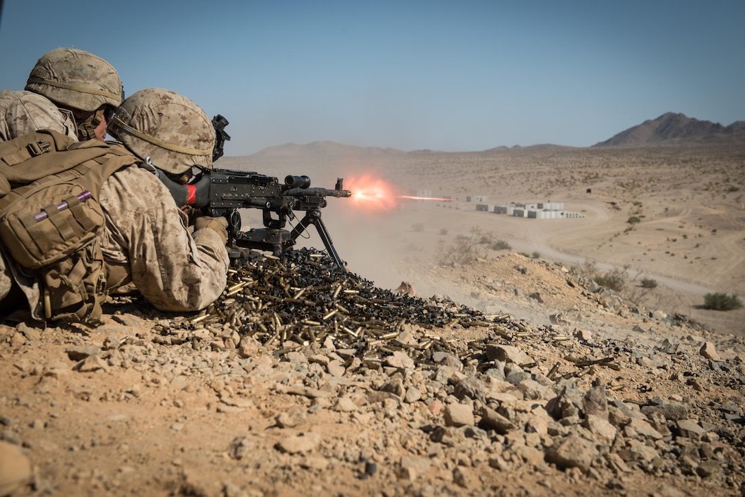 A Marine with Kilo Company, 3rd Battalion, 5th Marine Regiment, provides cover fire for his squad during the Marine Air-Ground Task Force Integrated Experiment (MIX-16) at Marine Corps Air Ground Combat Center Twentynine Palms, Calif., Aug. 5, 2016. The experiment was conducted to test new gear and assess its capabilities for potential future use. The Marine Corps Warfighting Lab (MCWL) identifies possible challenges of the future, develops new warfighting concepts, and tests new ideas to help develop equipment that meets the challenges of the future operating environment. 