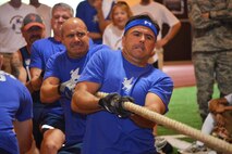 Col. Anthony Mastalir, 50th Space Wing vice commander, and Chief Master Sgt. John Bentivegna, 50 SW command chief, lead the 50 SW Chiefs and Eagles in a tug-o-war during the Tri-Wing Sports Day at Schriever Air Force Base, Colorado, Friday, Aug. 5, 2016. The overall competition came down to the tug-o-war and the 50 SW’s 2-0 record in the event earned the wing the Tri-Wing trophy. (U.S. Air Force photo/Brian Hagberg)