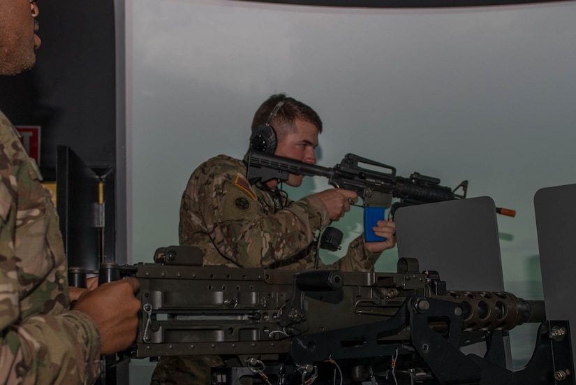 U.S. Army Soldiers assigned to the 203rd Transportation Detachment participate in vessel defense pre-deployment training at Fort Eustis, Va., Aug. 3, 2016. The vessel defense simulator has two M2 .50 cal machine guns and two MK19 40 mm grenade launchers which allowed the unit to practice communication and shooting hostile targets. (U.S. Air Force photo by Airman 1st Class Derek Seifert)
