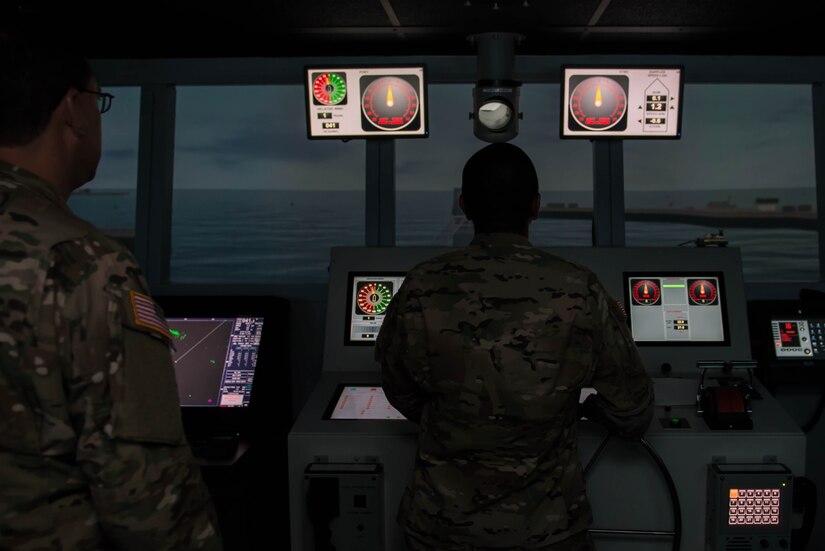 U.S. Army Soldiers participate in pre-deployment training in a simulator at Fort Eustis, Va., Aug. 2, 2016. The simulator allows Soldiers to practice steering and guiding a vessel into a dock in a variety of different environments. (U.S. Air Force photo by Airman 1st Class Derek Seifert)