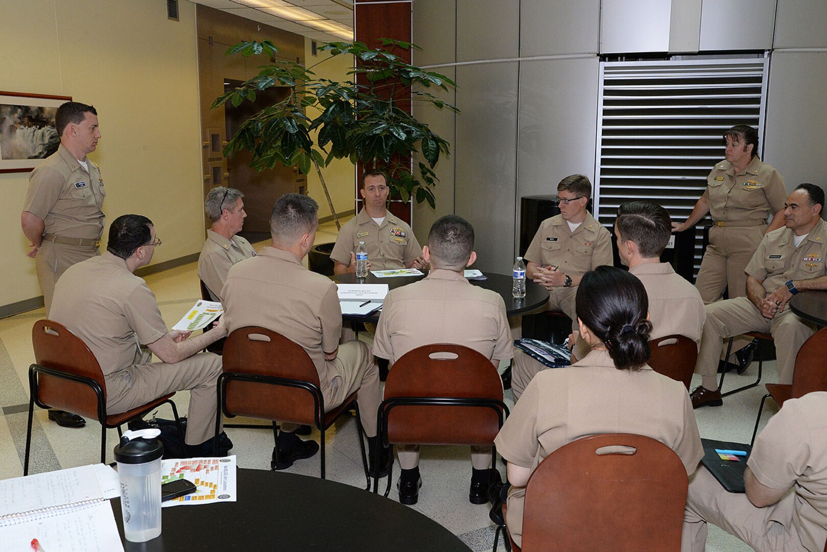 Participants of the Mid-Atlantic Norfolk Region Professional Development Symposium talk about job specific topics during a breakout session Aug. 6 at Defense Logistics Agency Headquarters, Fort Belvoir, Virginia. More than 100 junior officers attended the annual event to help familiarize and equip them with career and leadership tools.