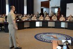 Navy Capt. Bob Schulof, Judge Advocate General's Corps with the Board of Correction of Naval Records, gives an ethics brief to participants of the Mid-Atlantic Norfolk Region Professional Development Symposium Aug. 6 at Defense Logistics Agency Headquarters, Fort Belvoir, Virginia. More than 100 junior officers attended the annual event to help familiarize and equip them with career and leadership tools.