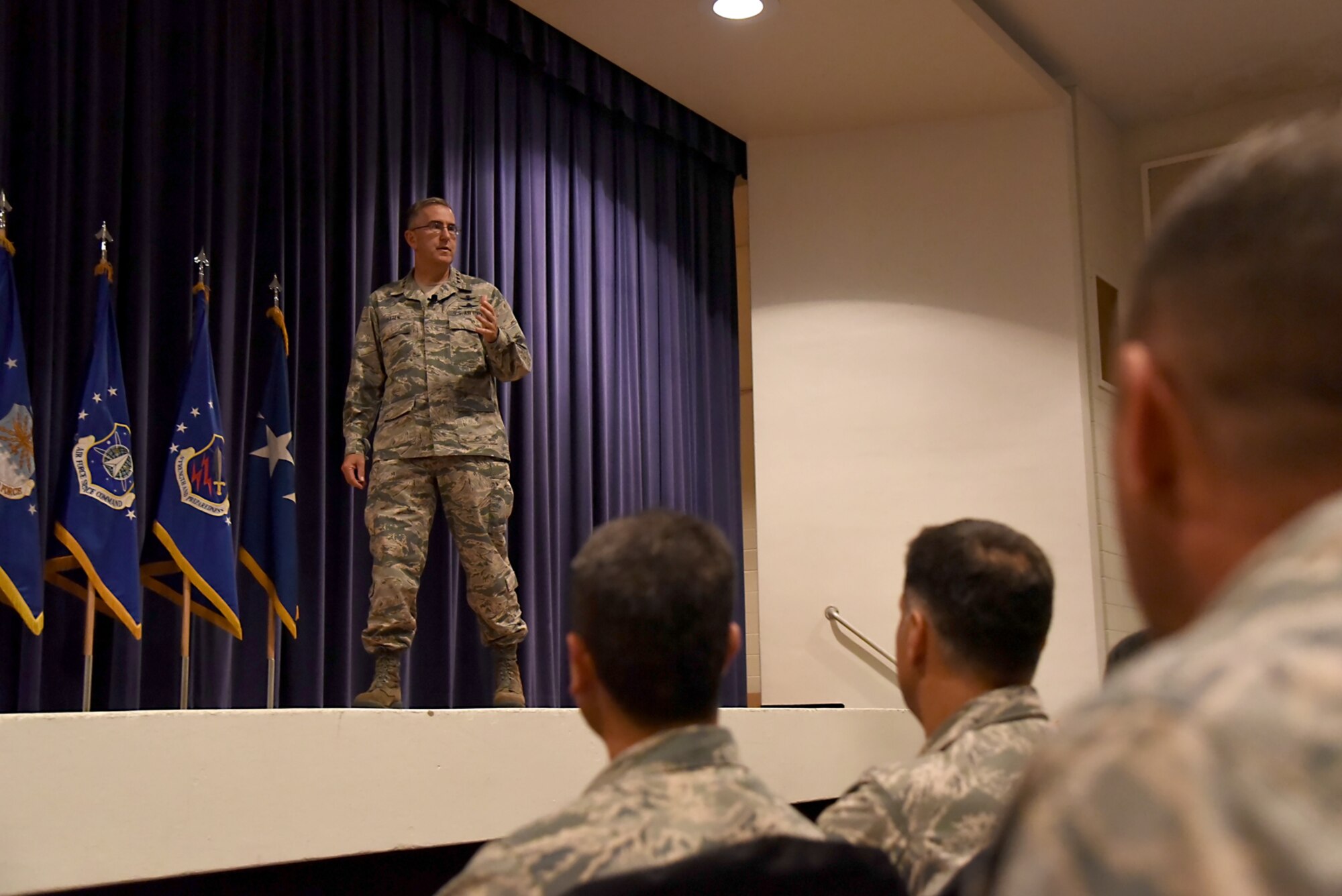 General John Hyten, Air Force Space Command commander, addresses Team Pete at an all call at the base auditorium on Peterson Air Force Base, Colo., Aug. 4, 2016. During his talk, General Hyten recognized the importance of the 21st Space Wing and discussed several issues, including his command priorities of  winning today’s fight, preparing for tomorrow’s fight, and taking care of our Airmen and our families; the damage caused from the recent hail storm that struck the base; and the topic of suicide within the Air Force (U.S. Air Force photo by Airman 1st Class Dennis Hoffman)