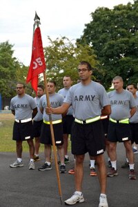 Not seen very often at the arsenal is a PT formation. Soldiers from the 305th Engineer Facility Detachment waiting for reveille to play. (Photo Credit: John B. Snyder)