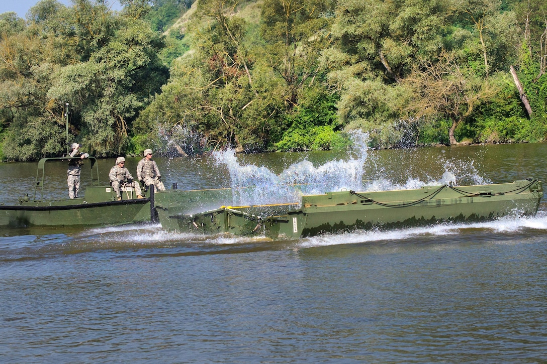Soldiers set up an improved ribbon bridge on the Olt River near Voila, Romania, during Exercise Saber Guardian 16,  Aug. 1, 2016. Army photo by Capt. John Farmer