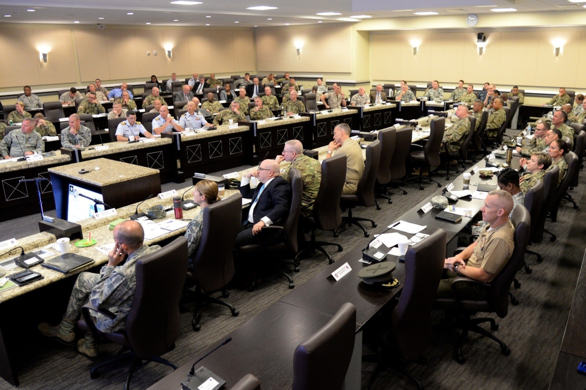 Military representatives from numerous Joint Force Headquarters- National Capital Region organizations listen to a brief during the JFHQ-NCR Commander’s Conference on Joint Base Andrews Aug. 8, 2016. The conference provides an opportunity for JFHQ-NCR organizations to plan and coordinate joint support for national special security events within the region. (U.S. Air Force photo/Tech. Sgt. Matt Davis)
