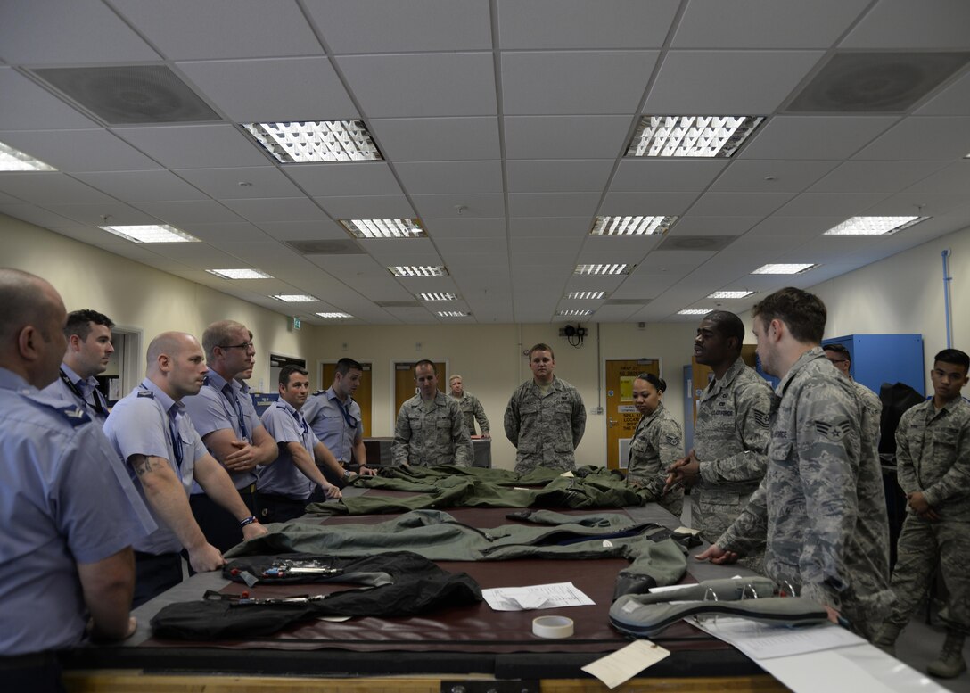 Royal Air Force Coningsby airmen visit the 48th Operations Support Squadron Aircrew Flight Equipment shop at RAF Lakenheath, England, Aug. 9. The RAF airmen toured the base after giving a similar tour to RAF Lakenheath Airmen a few weeks prior. (U.S. Air Force photo by Airman 1st Class Abby L. Finkel) 