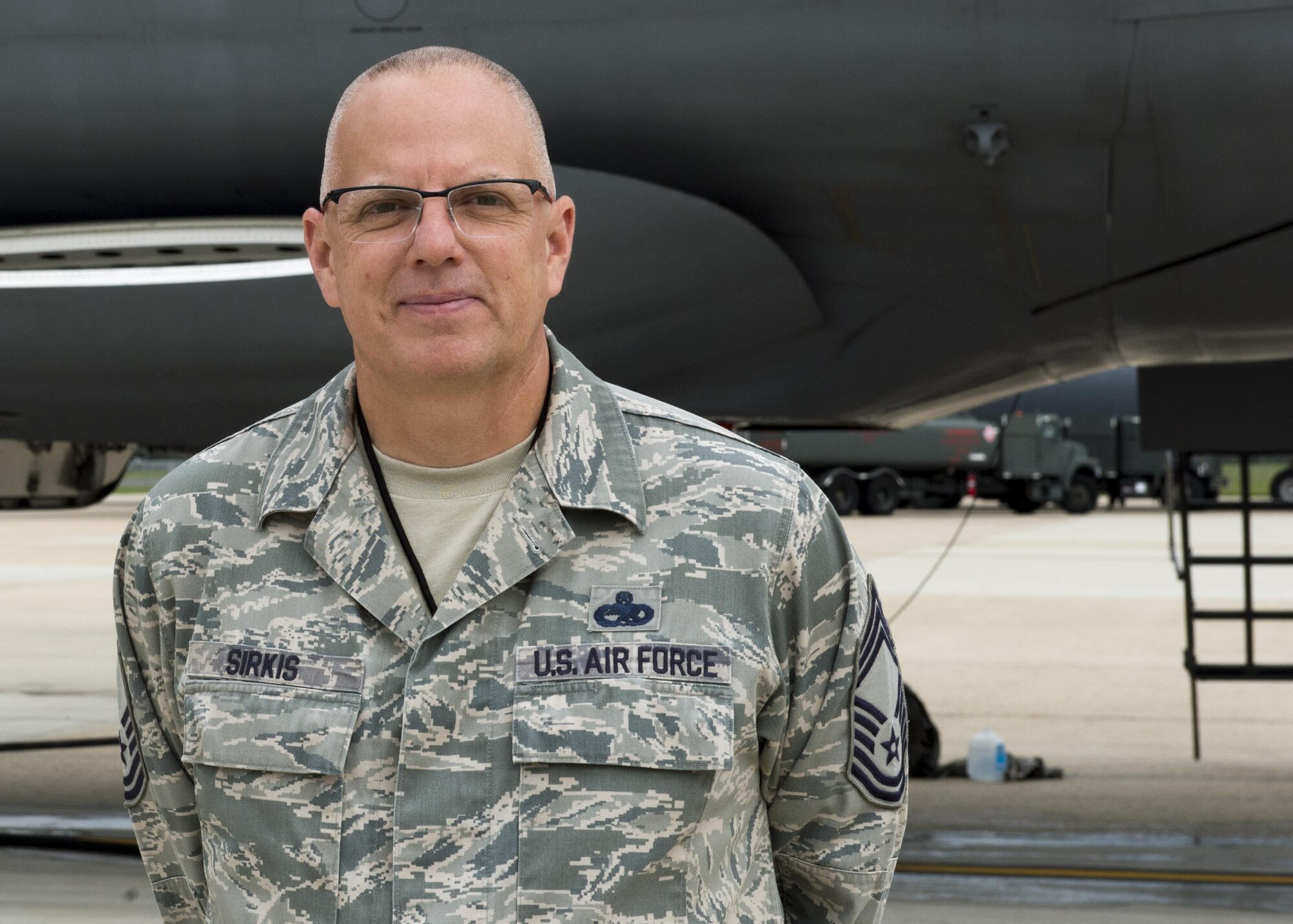 Chief Master Sgt. Matthew Sirkis, 512th Aircraft Maintenance Squadron superintendent, Dover Air Force Base, Del., poses next to a C-5 Super Galaxy Aug. 2, 2016, Joint Base McGuire-Dix-Lakehurst, NJ. Sirkis, a reservist, led more than 150 Airmen for a nearly six month TDY to JB MDL after part of the Dover AFB runway closed for reconstruction. (U.S. Air Force Photo/ Staff Sgt. Tiffany Lindemann)