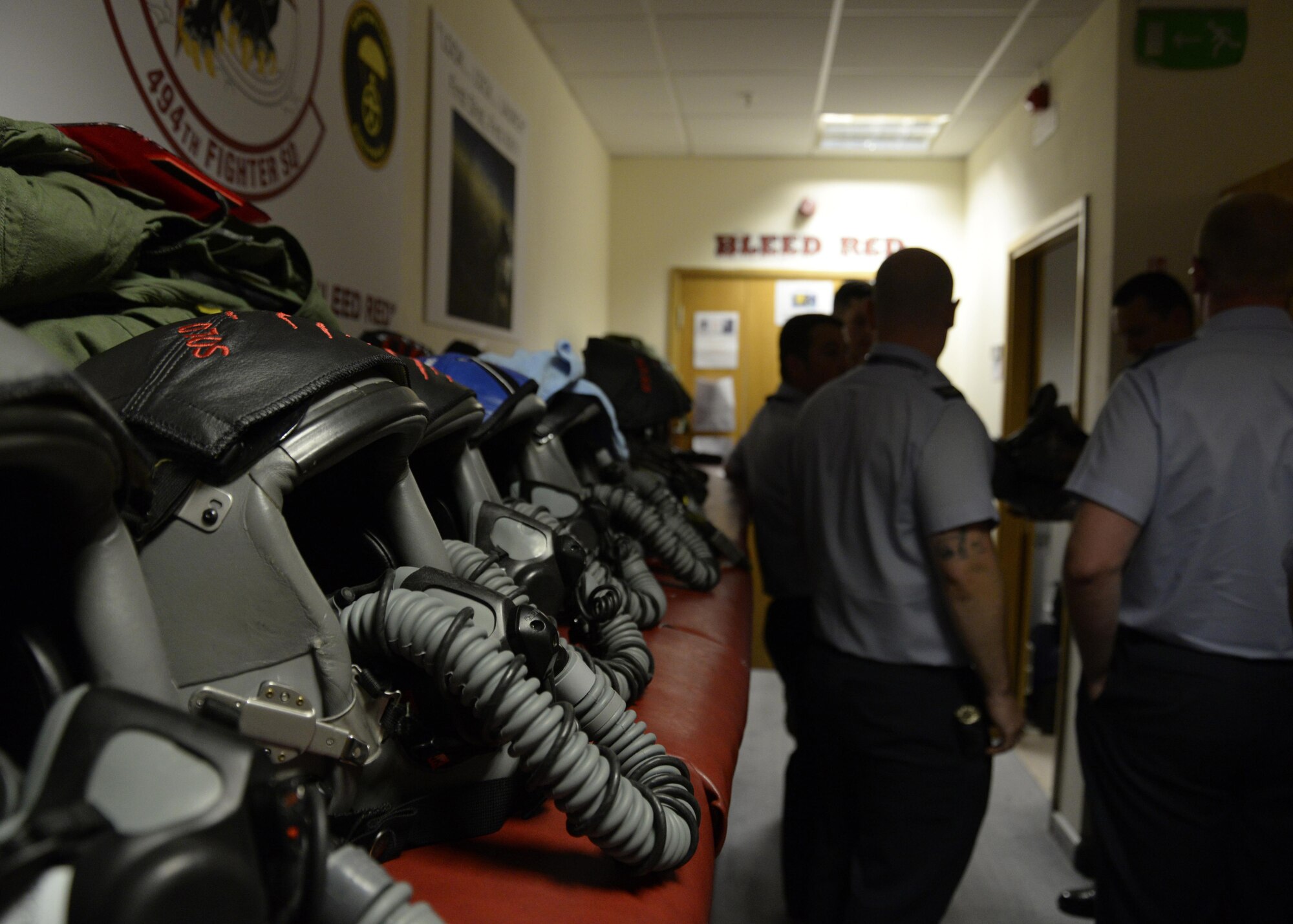 F-15E pilots helmets sit ready at the 494th Fighter Squadron during a base tour for Royal Air Force Coningsby airmen at RAF Lakenheath, England, Aug. 9. The 494th FS was one stop on a day-long tour for the U.K. airmen. (U.S. Air Force photo by Airman 1st Class Abby L. Finkel)