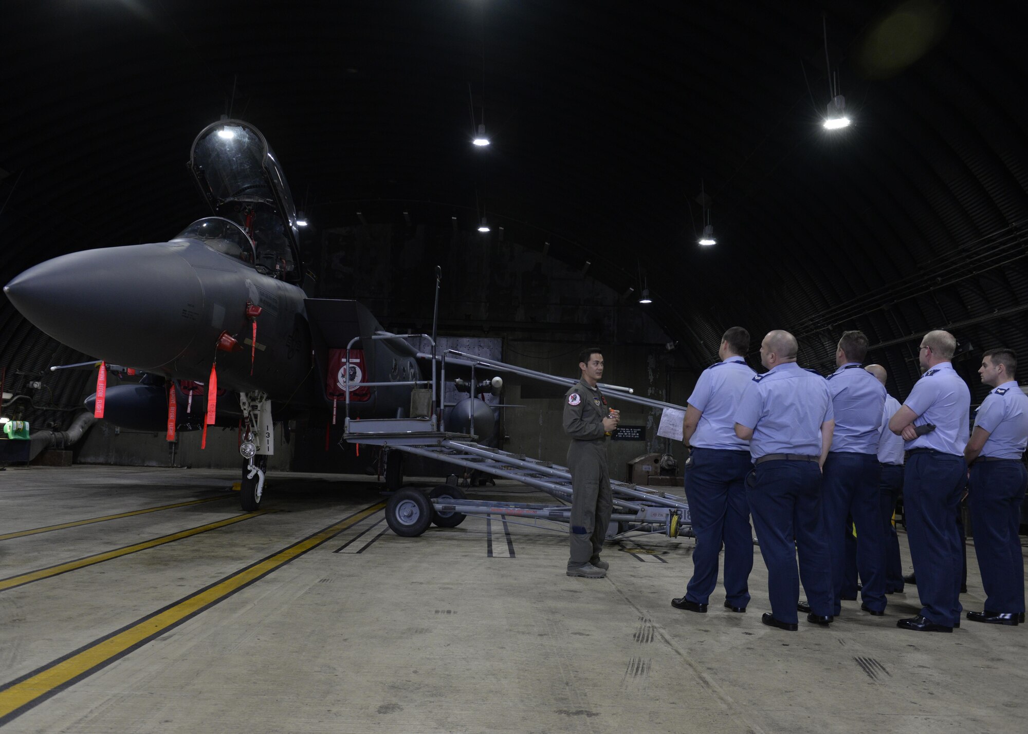 U.S. Air Force Capt. Michael Brewer, left, 494th Fighter Squadron equipment officer and F-15E pilot, shows airmen from Royal Air Force Coningsby an F-15E Strike Eagle at RAF Lakenheath, England, Aug. 9. RAF Coningsby hosted RAF Lakenheath Airmen on a similar tour a few weeks prior. (U.S. Air Force photo by Airman 1st Class Abby L. Finkel) 