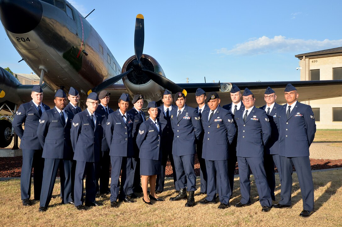 Airman Leadership School class 16-E stands before a static plane display on Goodfellow Air Force Base, Texas, Aug. 9, 2016. ALS is a six-week course designed to prepare senior airmen to assume supervisory duties, offering instruction in the practice of leadership and followership, written and oral communicative skills, and the profession of arms. (U.S. Air Force photo by Airman 1st Class Randall A. S. Moose/Released)