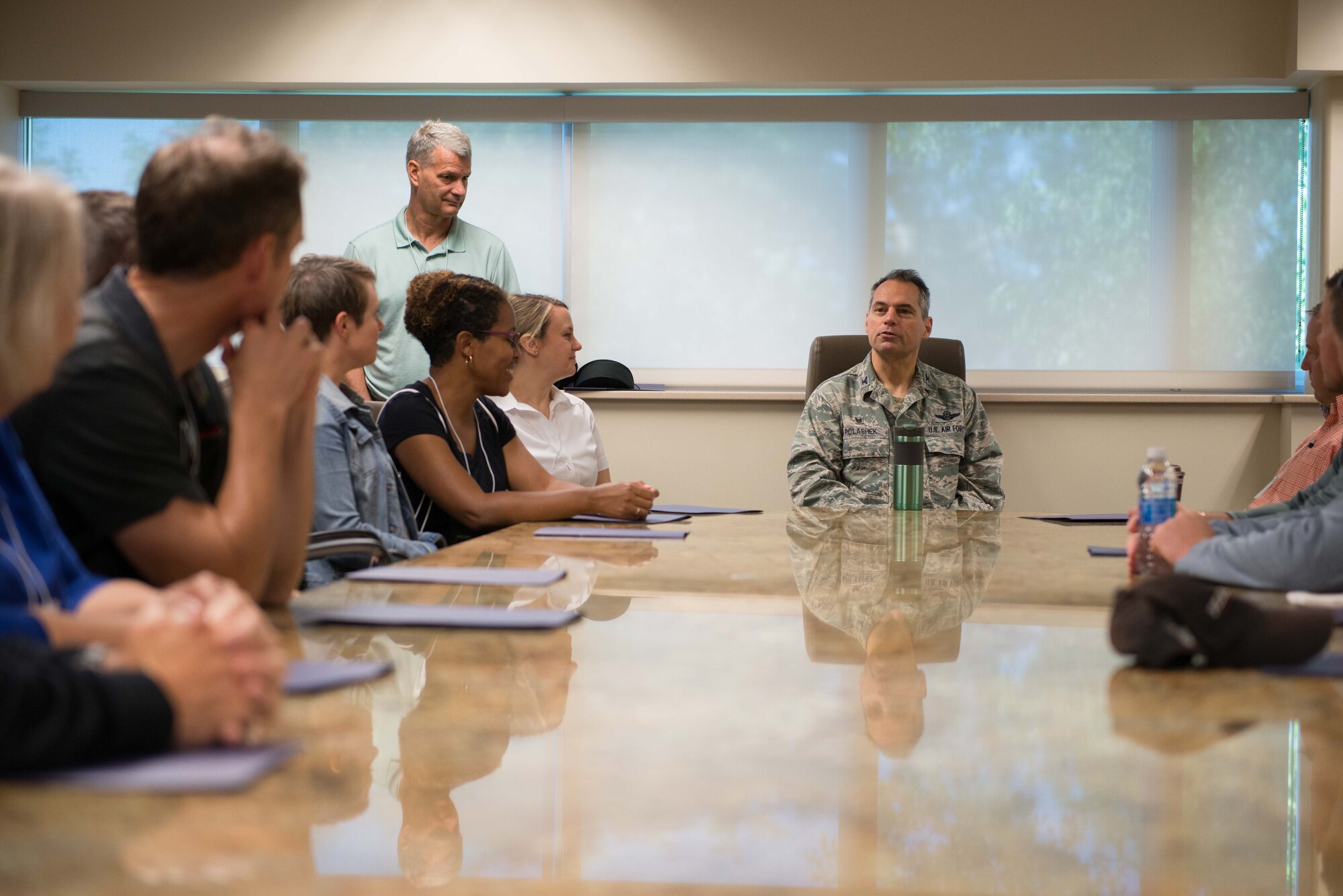 Civilian Employers of Reservists receive a mission briefing from Col. Tony Polashek, 934th Airlift Wing commander, during Employers Day Aug. 6.