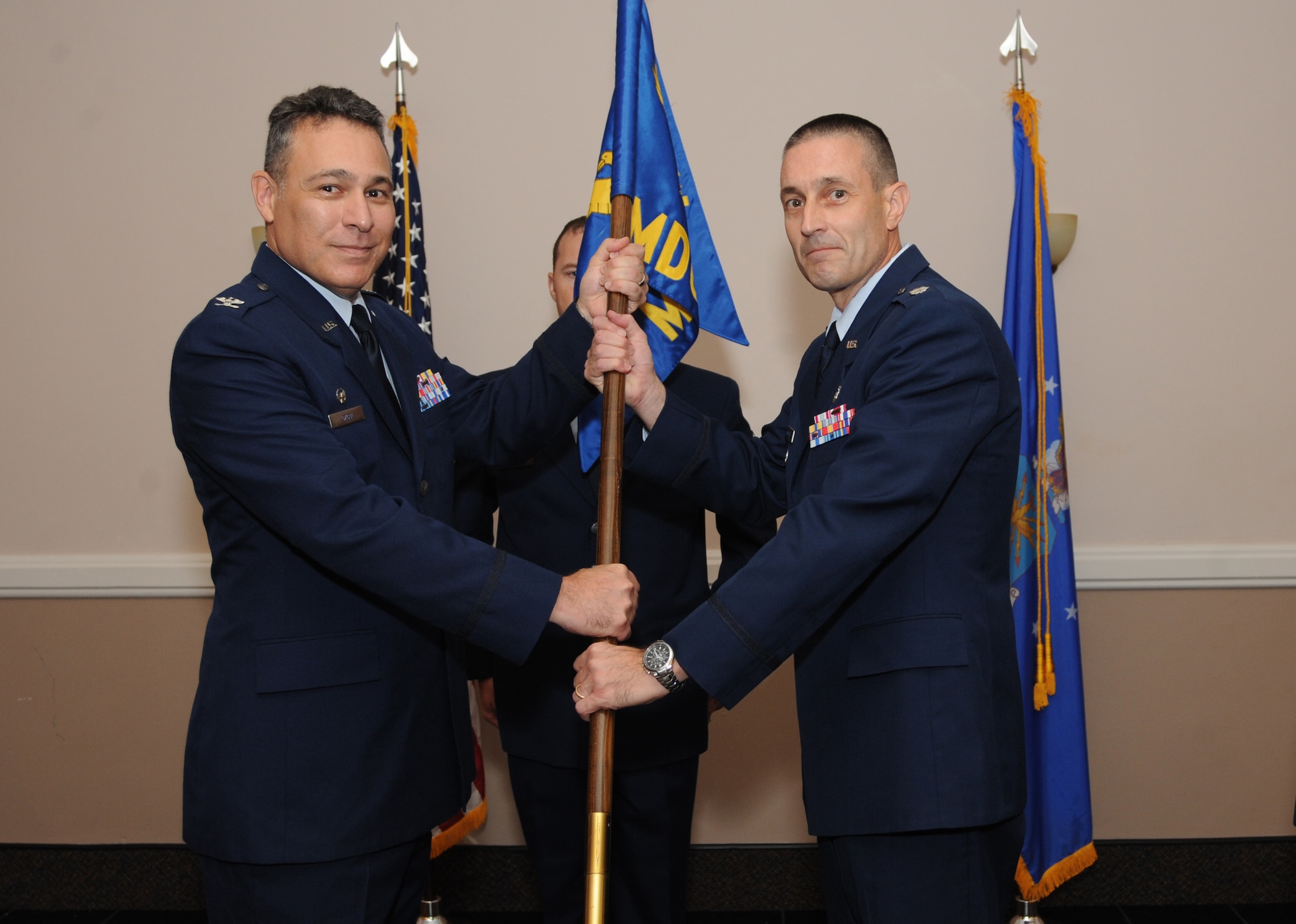 Lt. Col. David Walmsley accepts command of the 2nd Medical Operations Support Squadron during a change of command ceremony at Barksdale Air Force Base, La., June 27, 2016. During the permanent change of station season at Barksdale, 19 changes of command took place over the summer months, to include turnover in 13 squadrons and three groups, including the wing itself. (U.S. Air Force photo/ Airman Alexis Frost)