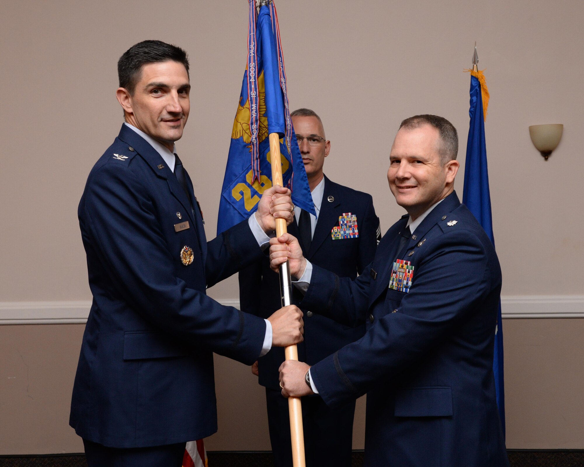 Lt. Colonel Ryan Kehoe accepts command of the 26th Operational Weather Squadron during a change of command ceremony at Barksdale Air Force Base, La., July 8, 2016. During the permanent change of station season at Barksdale, 19 changes of command took place over the summer months, to include turnover in 13 squadrons and three groups, including the wing itself. (U.S. Air Force photo/ Staff Sergeant Jannelle Dickey)