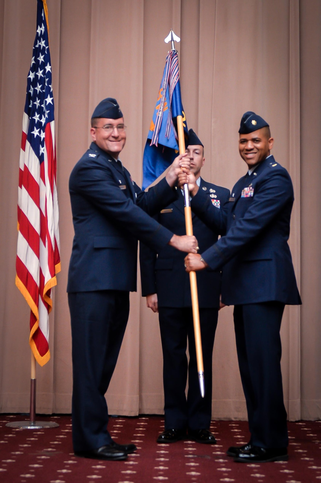 Maj. Illya Thomas accepts command of the 2nd Logistics Readiness Squadron during a change of command ceremony at Barksdale Air Force Base, La., July 8, 2016. During the permanent change of station season at Barksdale, 19 changes of command took place over the summer months, to include turnover in 13 squadrons and three groups, including the wing itself. (U.S. Air Force photo/ Senior Airman Mozer O. Da Cunha)