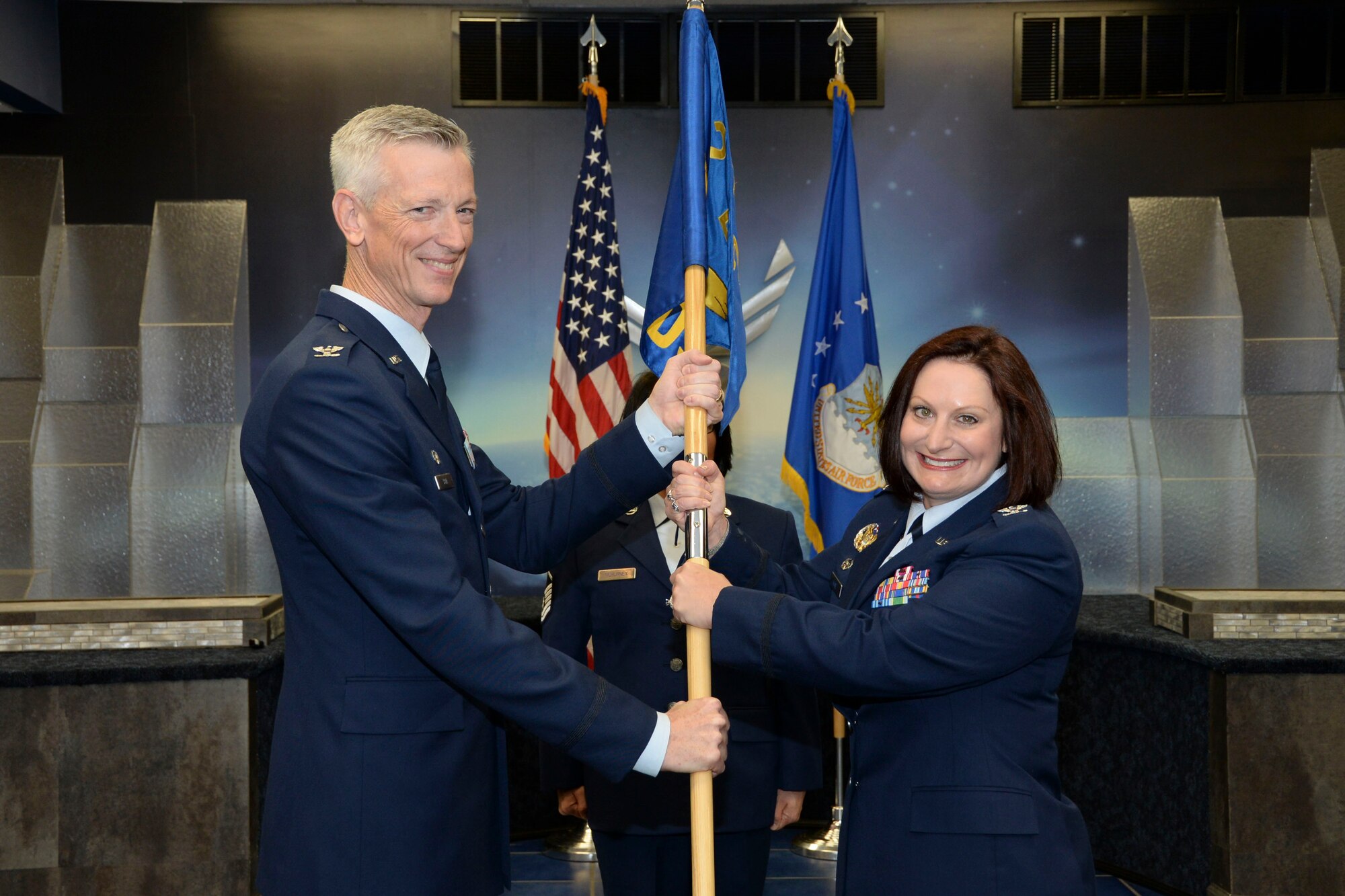 Col. Sheryl Kane accepts command of the 2nd Dental Squadron during a change of command ceremony at Barksdale Air Force Base, La., July 29, 2016. During the permanent change of station season at Barksdale, 19 changes of command took place over the summer months, to include turnover in 13 squadrons and three groups, including the wing itself. (U.S. Air Force photo/ Senior Airman Amanda Morris)