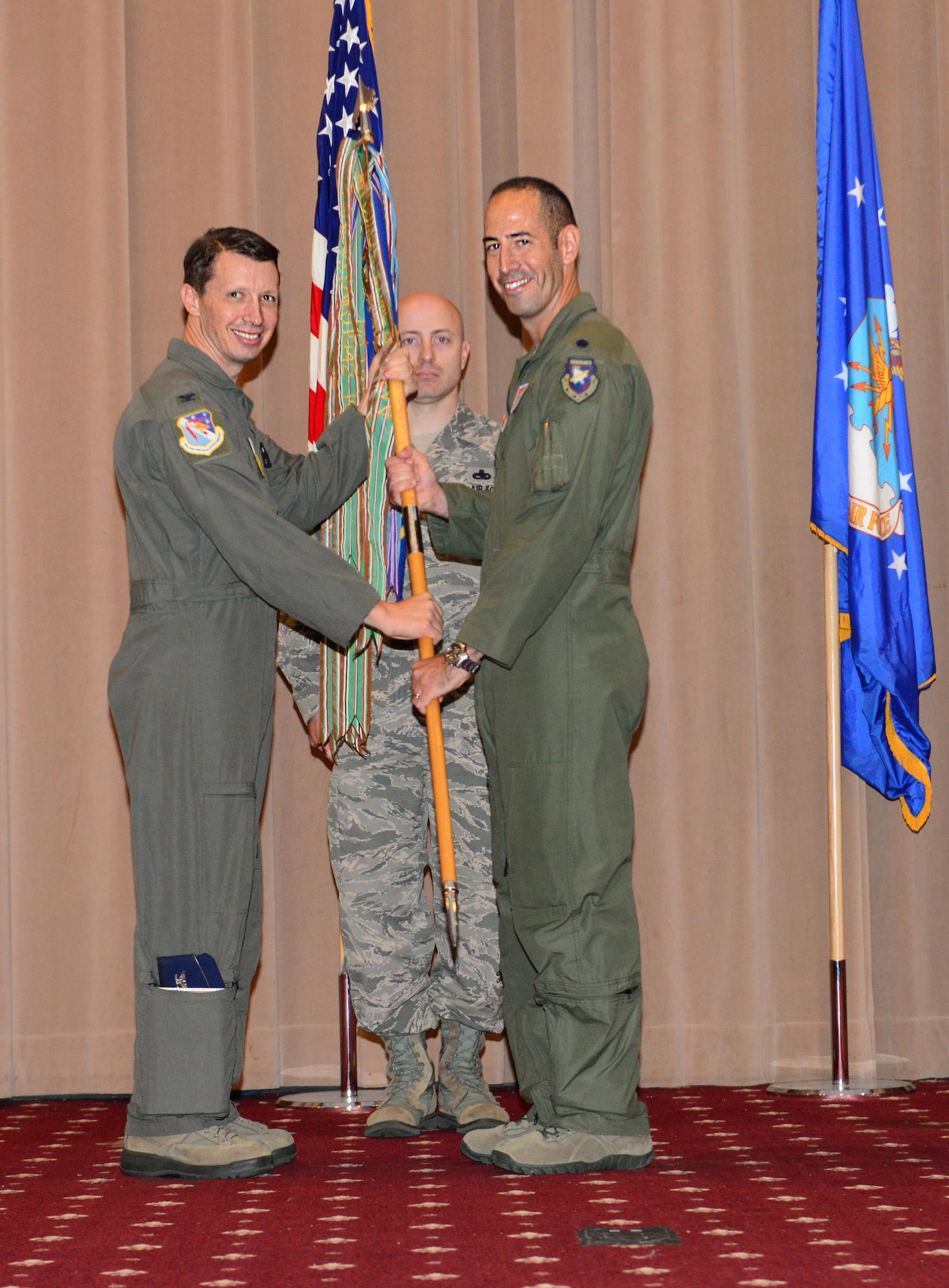 Lt. Col Joseph McKenna assumes command for the 49th Test and Evaluation Squadron at Barksdale Air Force Base, La., August 3, 2016. In this PCS season at Barksdale, 18 changes of commands span the summer months, to include turn over in 12 squadrons and three groups, as well as the Air Operations Center, the wing itself and even the 8th Air Force. (U.S. Air Force photo/Senior Airman Luke Hill)