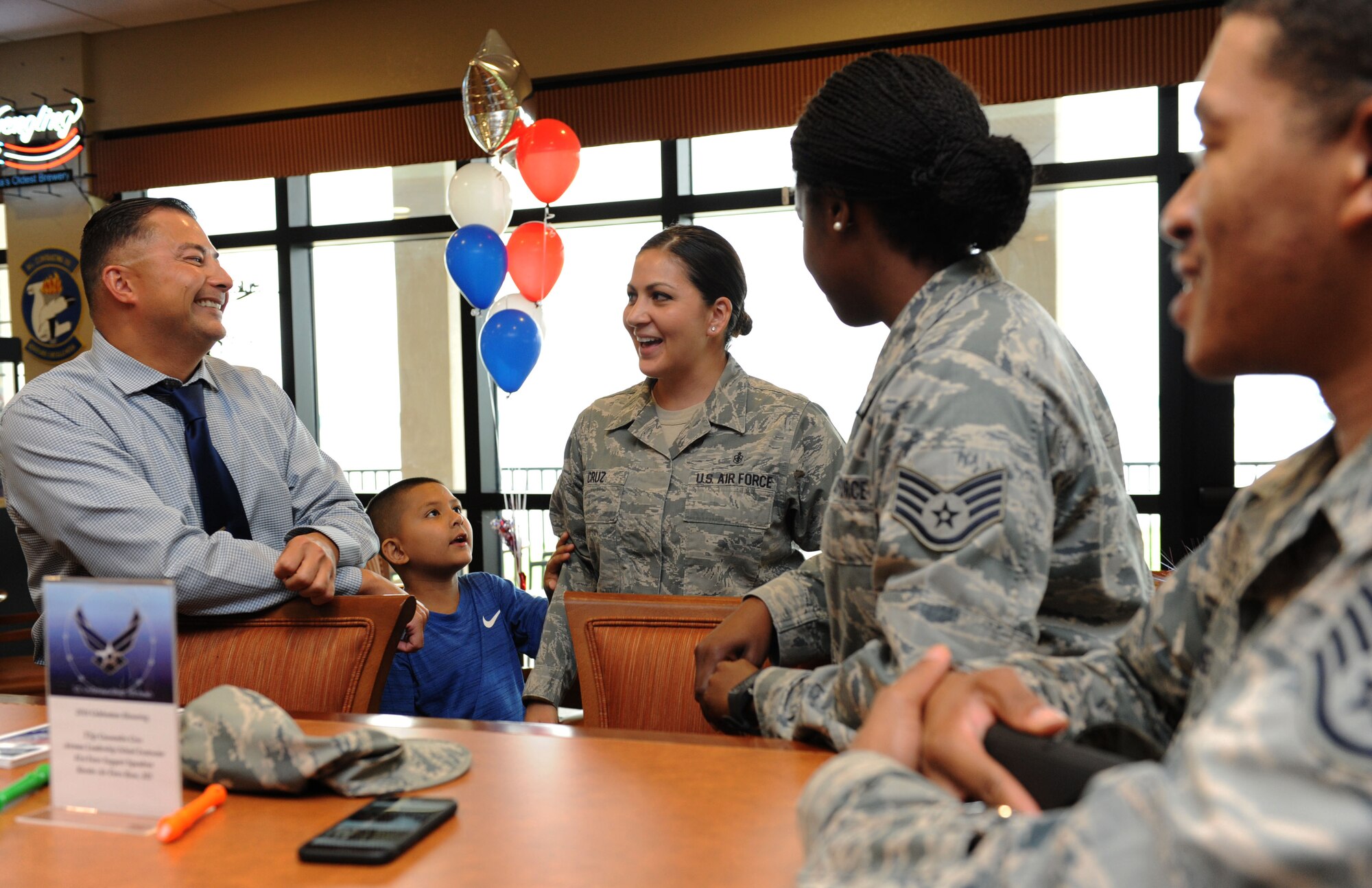 Tech. Sgt. Cassandra Cruz, 81st Force Support Squadron Airman Leadership School instructor, mingles with Keesler personnel during a recognition ceremony for her selection as one of the 12 Outstanding Airmen of the Year at the Bay Breeze Event Center Aug. 2, 2016, on Keesler Air Force Base, Miss. This award recognizes 12 enlisted personnel for their superior leadership, job performance, community involvement and personal achievements. (U.S. Air Force photo by Kemberly Groue/Released)