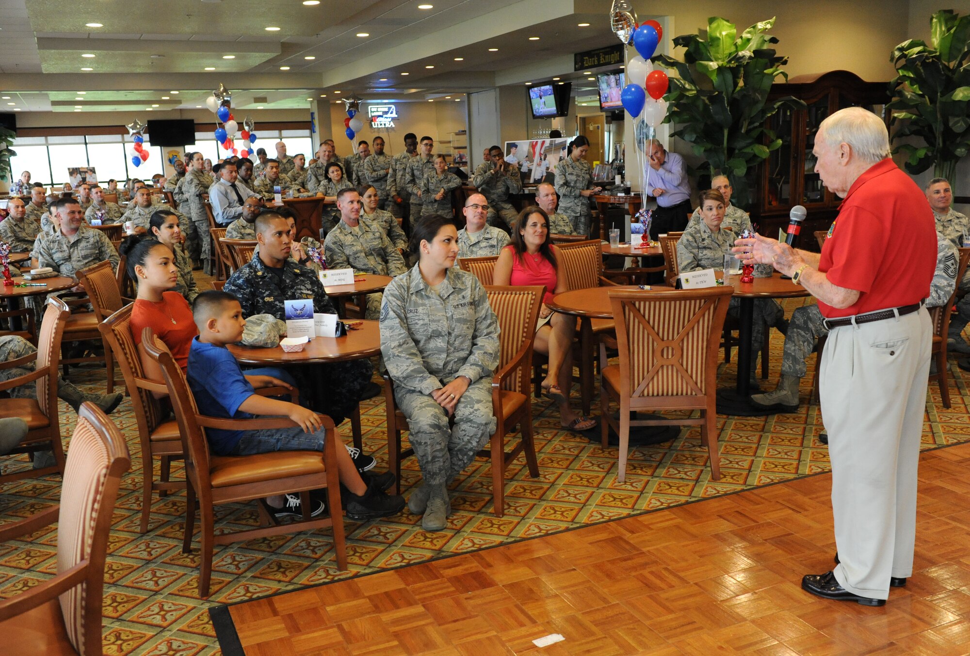 Retired Chief Master Sgt. Charles Teston delivers remarks about Tech. Sgt. Cassandra Cruz, 81st Force Support Squadron Airman Leadership School instructor, during a recognition ceremony for her selection as one of the 12 Outstanding Airmen of the Year at the Bay Breeze Event Center Aug. 2, 2016, on Keesler Air Force Base, Miss. This award recognizes 12 enlisted personnel for their superior leadership, job performance, community involvement and personal achievements. (U.S. Air Force photo by Kemberly Groue/Released)