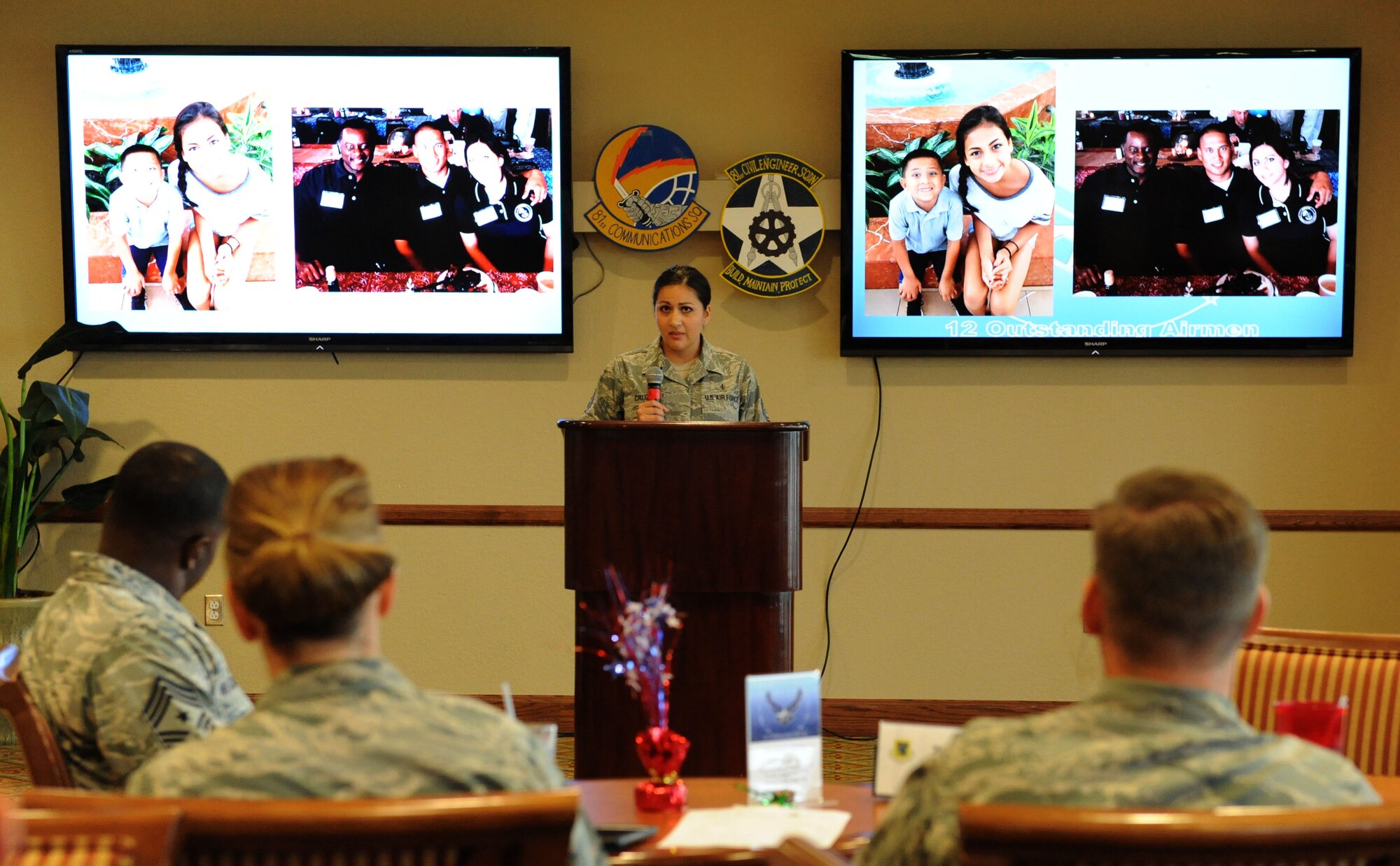 Tech. Sgt. Cassandra Cruz, 81st Force Support Squadron Airman Leadership School instructor, delivers remarks during a recognition ceremony for her selection as one of the 12 Outstanding Airmen of the Year at the Bay Breeze Event Center Aug. 2, 2016, on Keesler Air Force Base, Miss. This award recognizes 12 enlisted personnel for their superior leadership, job performance, community involvement and personal achievements. (U.S. Air Force photo by Kemberly Groue/Released)