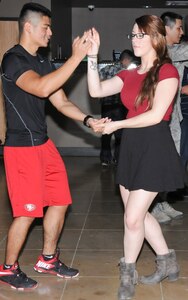 Navy Seaman Charlie Francisco (left) and Army Pvt. Samantha Skinner, both students at the Medical Education and Training Campus at Joint Base San Antonio-Fort Sam Houston, dance during a class hosted by the Navy Medicine Training Support Center’s Diversity Council.