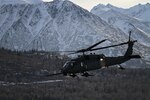 An Alaska Air National Guard HH-60 Pave Hawk, from the 210th Rescue Squadron, is on a training flight near Joint Base Elmendorf-Richardson in February 2013.A similar aircraft helped save the plane crash survivors.