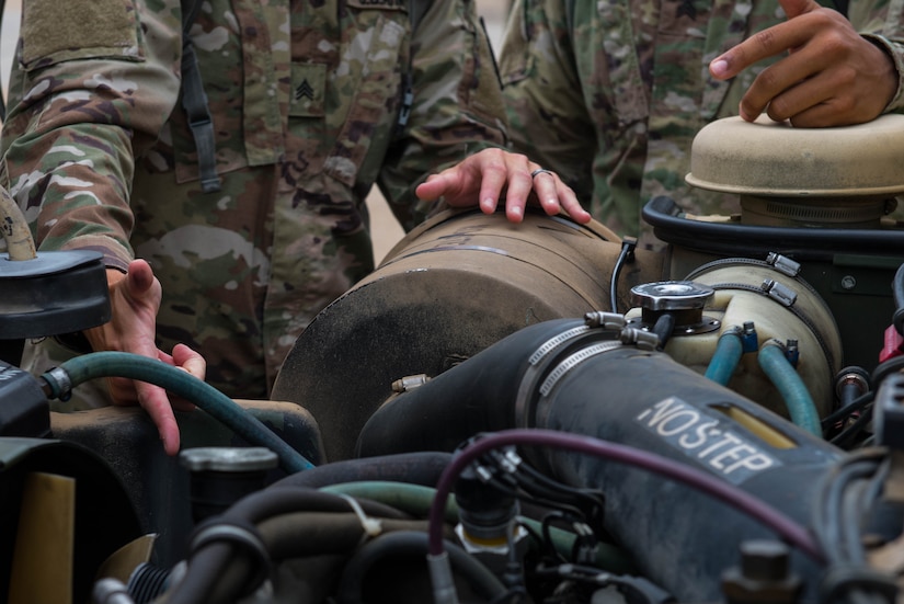 U.S. Army Soldiers assigned to 10th Battalion 149th Seaport Operations Company fix a Humvee at Fort Eustis, Va., Aug. 8, 2016. The company maintains vehicles such as the Humvee, Kalmar forklift and 10 ton Forklifts. (U.S. Air Force photo by Airman 1st Class Derek Seifert)