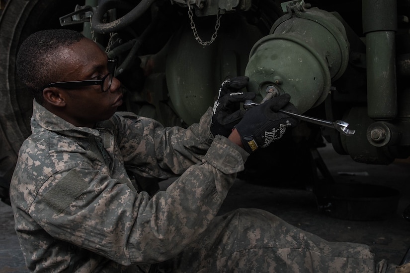 U.S. Army Pfc. Trevis Rodney, 10th Battalion 149th Seaport Operations Company wheeled vehicle mechanic, works on a M988 Wrecker hub at Fort Eustis, Va., Aug. 8, 2016. Rodney is responsible for inspecting, repairing and testing wheeled vehicles and material handling equipment systems, subsystems and components. (U.S. Air Force photo by Airman 1st Class Derek Seifert)