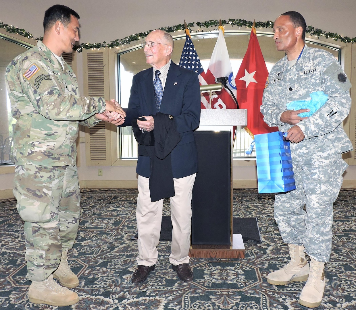 Guest speaker retired Army Maj. Gen. Floyd W. Baker (center) accepts a token of appreciation from Maj. Gen. K.K. Chinn (left), U.S. Army South commanding general, and Chaplain (Lt. Col.) Roy Walker (right), at the conclusion of the command’s quarterly prayer luncheon.