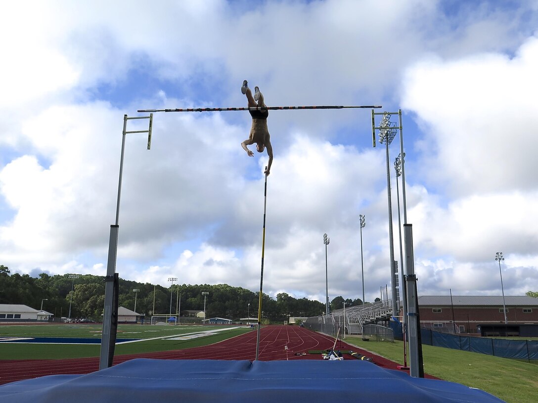 Oxford, Miss. - U.S Army Reserve 2nd Lt. Sam Kendricks strives to make his way over the bar as he trains for the Rio 2016 Olympics at his former high school, Oxford High School, in Oxford, Mississippi, July 27, 2016. Kendricks, a member of the Army Reserve 655th Transportation Company in Millington, Tenn., will be competing in the pole vault event for Team U.S.A. (U.S. Army Reserve photo)