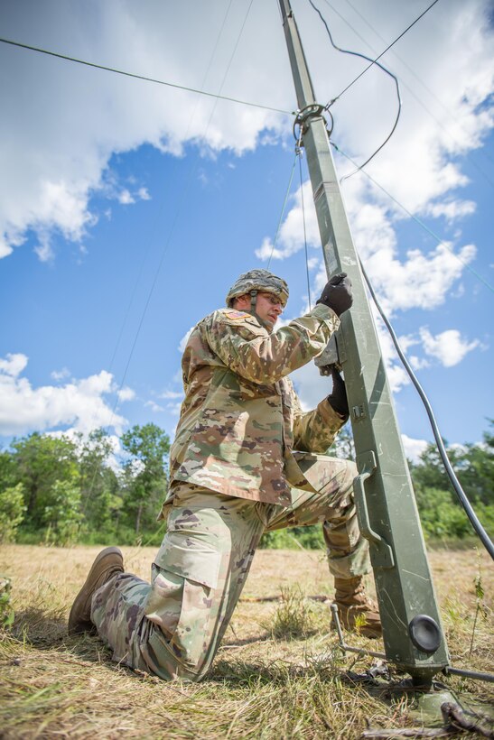 U.S. Army Sgt. Kerry Bence,  67th Expeditionary Signal Battalion, raises an OE254 Antenna during Combat Support Training Exercise (CSTX) 86-16-03 at Fort McCoy, Wis., August 6, 2016. The 84th Training Command’s third and final Combat Support Training Exercise of the year hosted by the 86th Training Division at Fort McCoy, Wis. is a multi-component and joint endeavor aligned with other reserve component exercises. (U.S. Army photo by Spc. John Russell/Released)