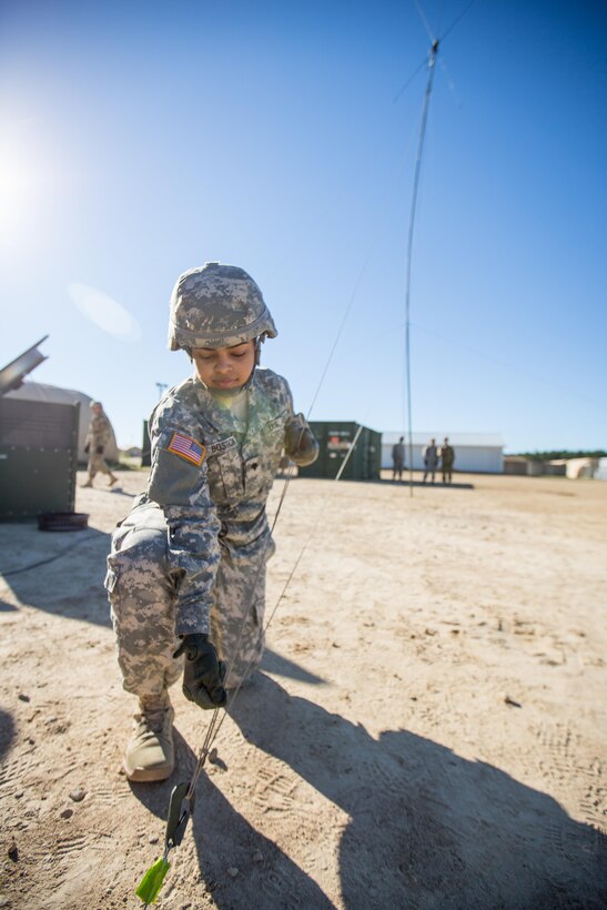 U.S. Army Spc. Siarah Bostic,  47th Combat Support Hospital, 62nd Medical Brigade, adjusts a guide rope  on an OE254 Antenna during Combat Support Training Exercise (CSTX) 86-16-03 at Fort McCoy, Wis., August 6, 2016. The 84th Training Command’s third and final Combat Support Training Exercise of the year hosted by the 86th Training Division at Fort McCoy, Wis. is a multi-component and joint endeavor aligned with other reserve component exercises. (U.S. Army photo by Spc. John Russell/Released)