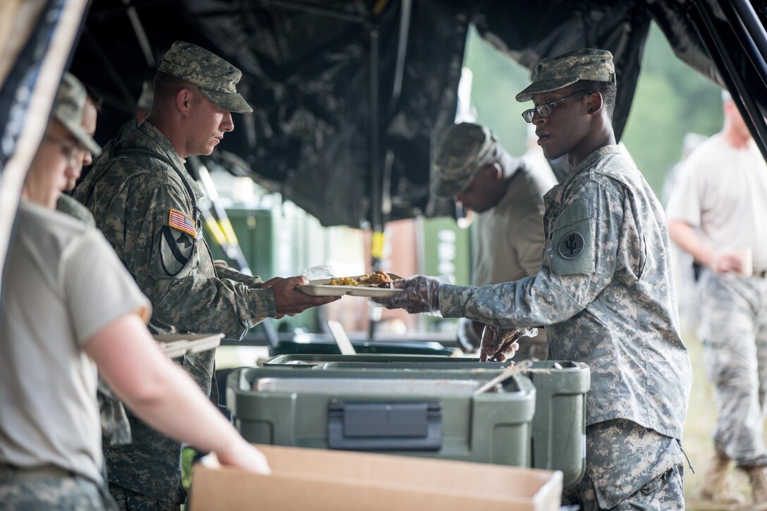 U.S. Army Spc. Samuel Bankhead, 459th Transportation Company, Elgin, Ill., serves food to Soldiers from the 644th Regional Support Group during Combat Support Training Exercise (CSTX) 86-16-03 at Fort McCoy, Wis., August 8, 2016. The 84th Training Command’s third and final Combat Support Training Exercise of the year hosted by the 86th Training Division at Fort McCoy, Wis. is a multi-component and joint endeavor aligned with other reserve component exercises. (U.S. Army photo by Spc. John Russell/Released)