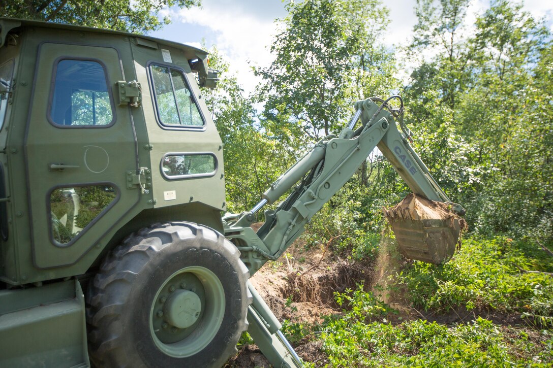 U.S. Army Reserve Soldier Spc. Alexander Blunt, 465th Engineering Company, 926th Engineer Batralion, digs a trench with a back hoe loader (BHL) during Combat Support Training Exercise (CSTX) 86-16-03 at Fort McCoy, Wis., August 6, 2016. The 84th Training Command’s third and final Combat Support Training Exercise of the year hosted by the 86th Training Division at Fort McCoy, Wis. is a multi-component and joint endeavor aligned with other reserve component exercises. (U.S. Army photo by Spc. John Russell/Released)