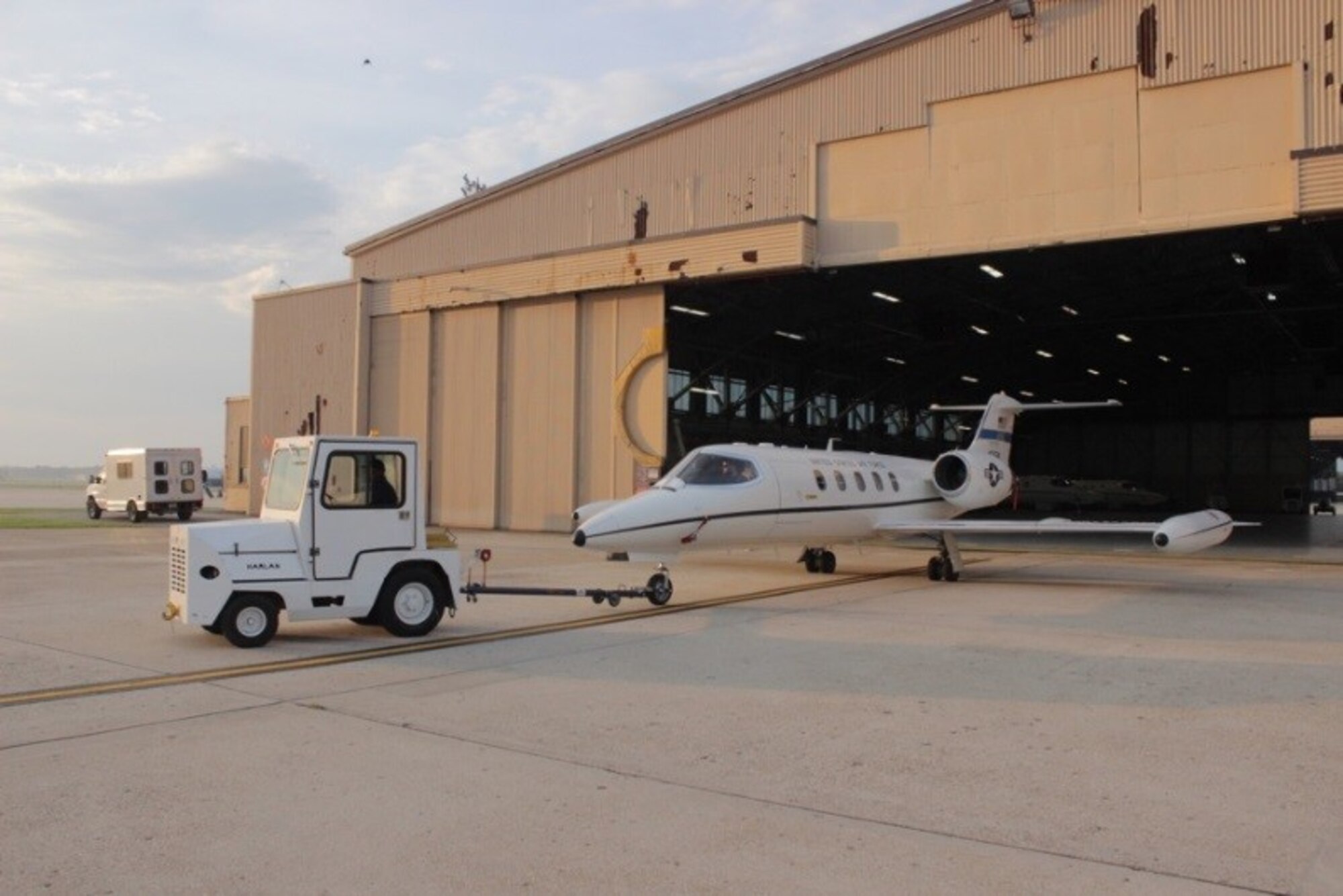 M1 maintainers at Joint Base Andrews tow a 457th Airlift Squadron C-21A out of the hangar in preparation for a distinguished visitor mission. (Photo courtesy of the 457th Airlift Squadron)