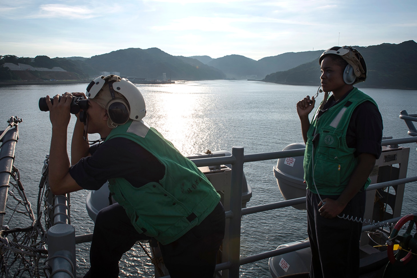 Logistics Specialist Seaman Recruit Argenis Pena, left, and Logistics Specialist 3rd Class Saskia France, right, both assigned to amphibious assault ship USS Bonhomme Richard (LHD 6), stand phone talker watch as the ship departs Sasebo, Japan, Aug, 6, 2016, for its fall patrol. Bonhomme Richard is the flagship of the Bonhomme Richard Expeditionary Strike Group and is forward-deployed in the U.S. 7th Fleet area of operation. 


