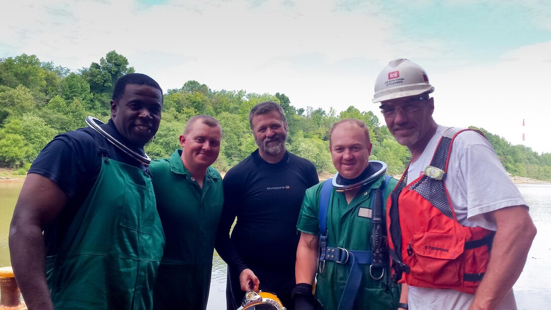 Members of the Louisville Repair Station Dive team participated in an Acclimation and Refresher dive event at Greenup Locks and Dam on the Ohio River at Greenup, Kentucky. Left to Right are Sam Lowery, Andrew (Skeeter) Smith, Bill Holland, Charlie Smith and James Harris. Sam Lowery and Andrew Smith are Divers in Training and completed their first dives at the event. 