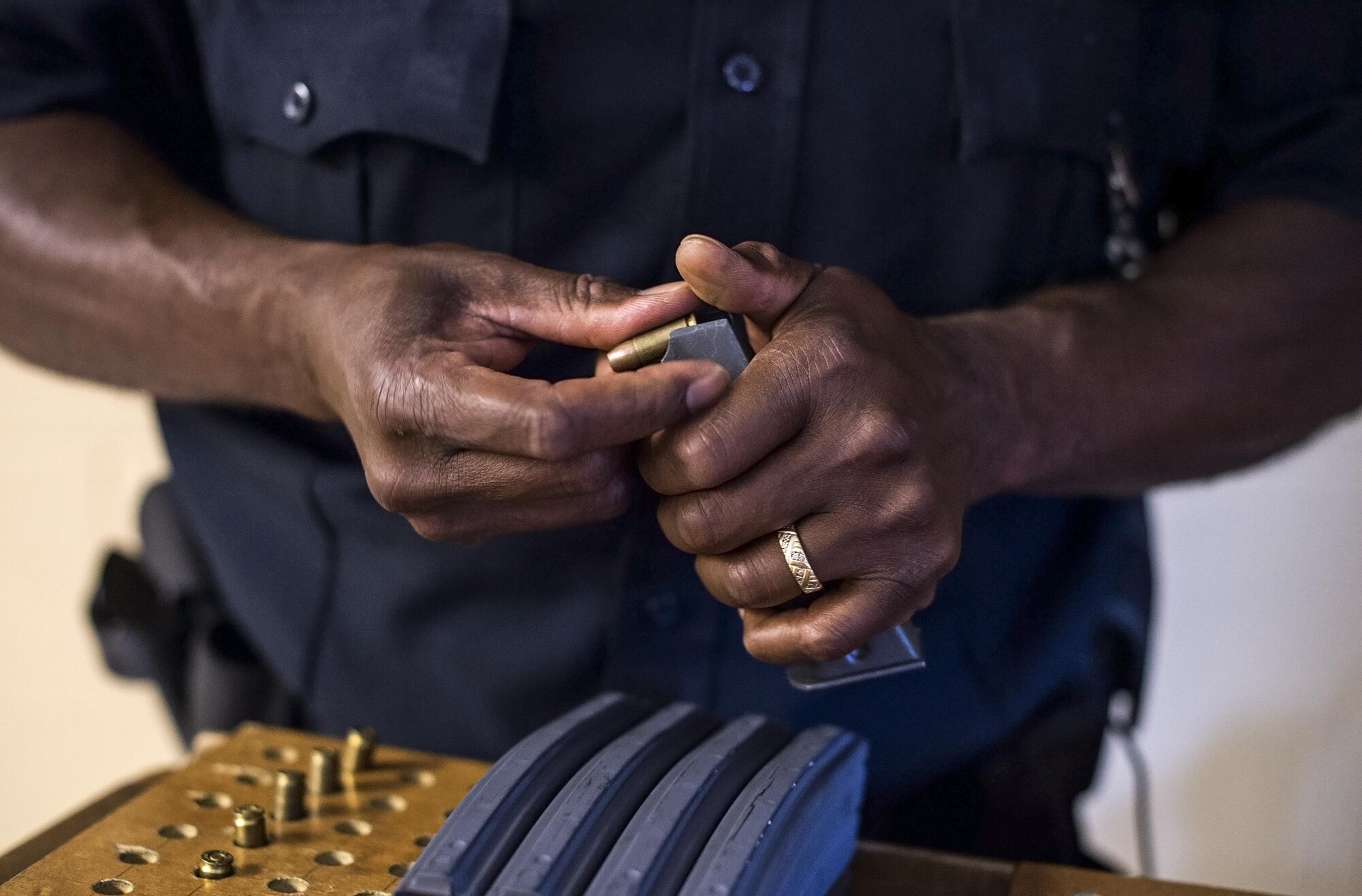 James Williams, 23d Security Forces Squadron patrolman, loads a magazine, Aug. 9, 2016, at Moody Air Force Base, Ga. Moody’s 23d SFS armory stores more than 1.5 million dollars worth of weapons systems that are .50 caliber or less. (U.S. Air Force photo by Airman 1st Class Robinson)