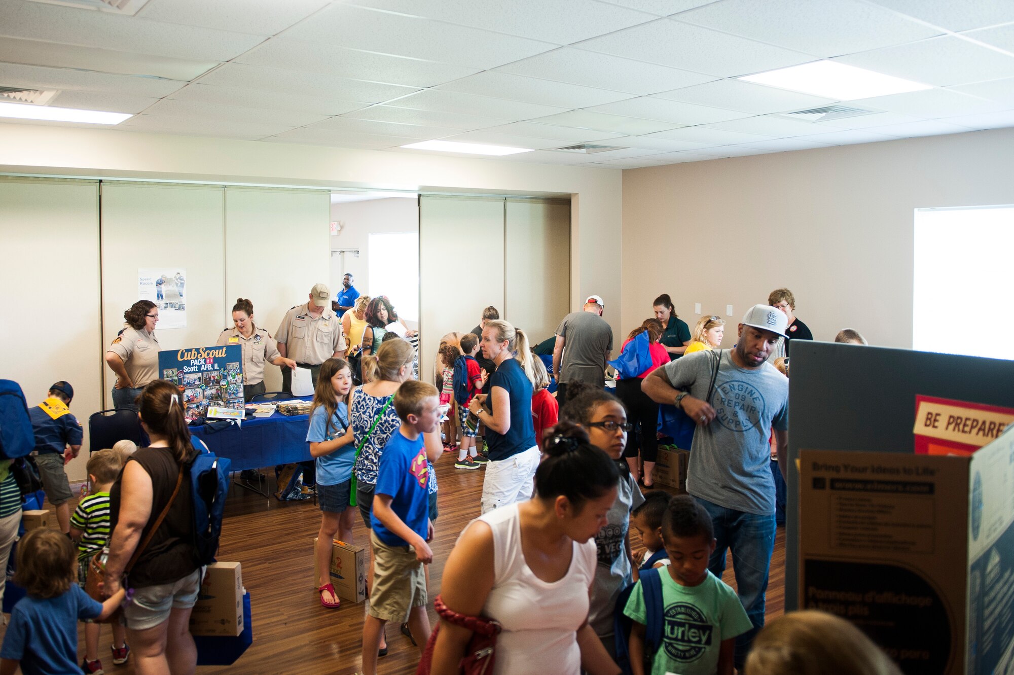 Team Scott families attend the Back to School Brigade at Scott Air Force Base, Ill. Aug. 6, 2016. Operation Homefront hosted the event, which supplied backpacks and school supplies to 600 children. (U.S. Air Force photo by Staff Sgt. Clayton Lenhardt/Released)