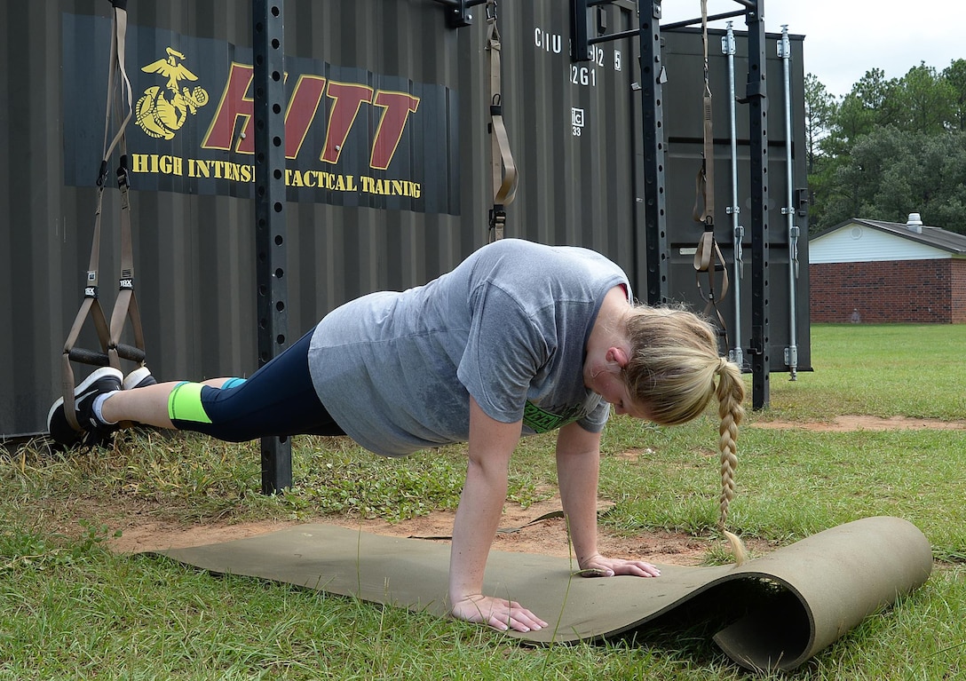 2nd Lt. Delaney T. Bourlakov, adjutant, Marine Corps Logistics Base Albany, conducts a TRX plank during her High Intensity Tactical Training, Aug. 5. She will be representing MCLB Albany at the second annual High Intensity Tactical Training Athlete Championship, Aug. 15-18, at Marine Corps Air Station Miramar in San Diego, Calif.