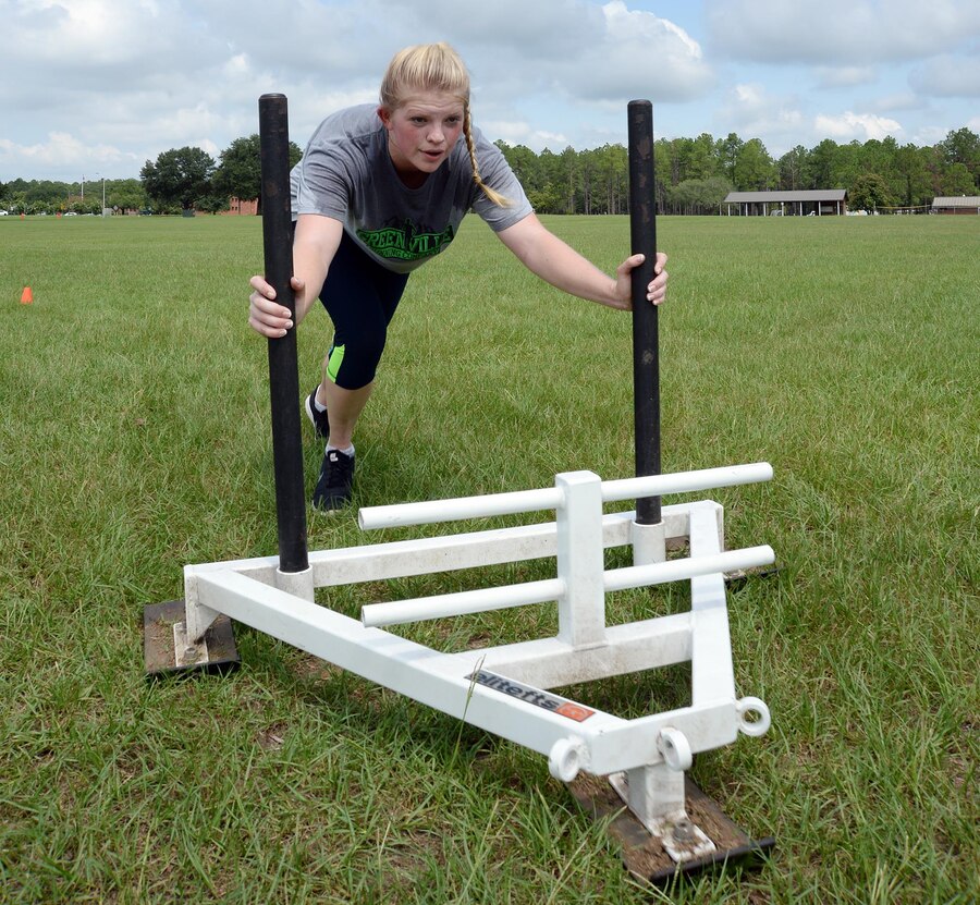 2nd Lt. Delaney T. Bourlakov, adjutant, Marine Corps Logistics Base Albany, conducts an extended--arm sled push during her High Intensity Tactical Training class, Aug. 5. She is preparing for her competition at the second annual High Intensity Tactical Training Athlete Championship, Aug. 15-18, at Marine Corps Air Station Miramar in San Diego, Calif.