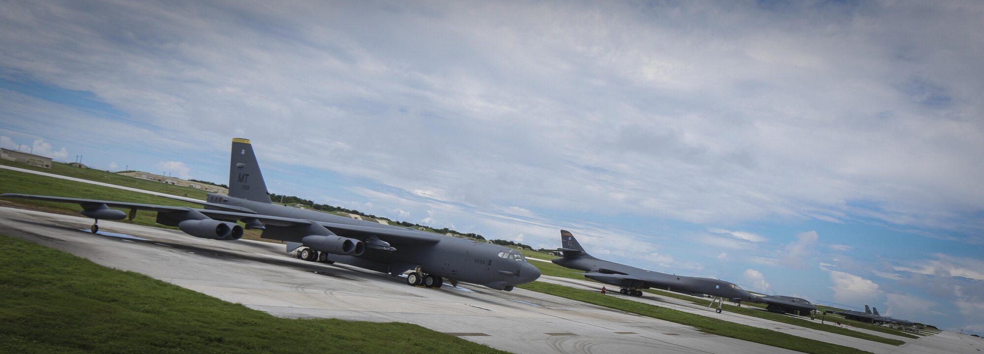 A B-52 Stratofortress, B-1 Lancer and B-2 Spirit sit beside one another on the flightline at Andersen Air Force Base, Guam, Aug.10, 2016. This marks the first time in history that all three of Air Force Global Strike Command's strategic bomber aircraft are simultaneously conducting operations in the U.S. Pacific Command area of operations. The B-1 Lancer, which arrived at Andersen Aug. 6, will replace the B-52 in support of the U.S. Strategic Command Continuous Bomber Presence mission. The CBP bomber swap between the B-1 and B-52 is occurring throughout the month of August as the B-1s return to support this mission for the first time since April 2006. In addition to the CBP bomber swap, three B-2s arrived in theater to conduct a Bomber Assurance and Deterrence deployment. The CBP mission and BAAD deployments are part of a long-standing history of maintaining a consistent bomber presence in the Indo-Asia-Pacific in order to maintain regional stability, and provide assurance to our allies and partners in the region. (U.S. Air Force photo by Tech. Sgt. Richard Ebensberger)