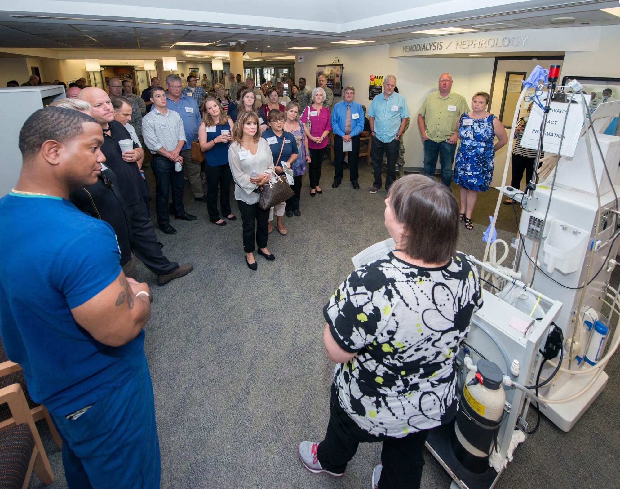 Kimberly Green, 60th Medical Operations Squadron hemodialysis technician, gives a briefing to honorary commanders during their tour of David Grant USAF Medical Center at Travis Air Force Base, Calif., July 29, 2016. (U.S. Air Force photo by Louis Briscese)