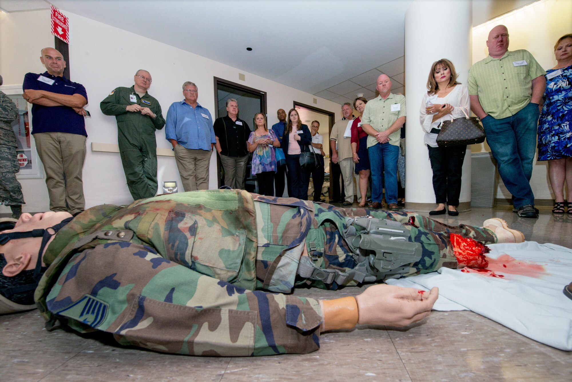 Honorary Commanders get a briefing on the Multiple Amputee Trauma Trainer mannequin at the simulation center during their tour of David Grant USAF Medical Center at Travis Air Force Base, Calif., July 29, 2016. (U.S. Air Force photo by Louis Briscese)