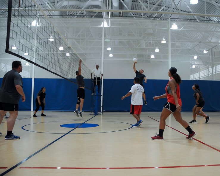The 2nd Logistics Readiness Squadron volleyball team spikes the ball during an intramural volleyball game at Barksdale Air Force Base, La., Aug. 8, 2016. The 2nd LRS won the second set 25 to 20 against Air Force Global Strike Command. (U.S. Air Force photo/Airman 1st Class Stuart Bright)